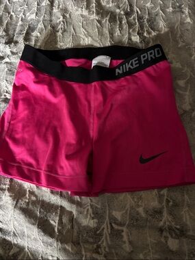 Nike pro pink shorts. Pink and black size large great condition.